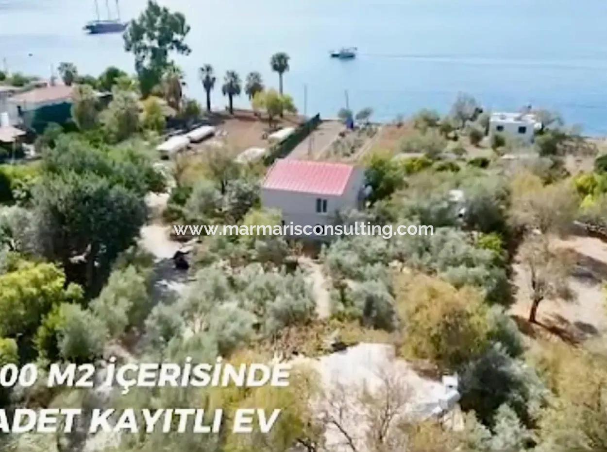 Marmaris Söğüt Mahallesi Denize Sıfır 2000M2 Arsa Satılık Müstakil Ev.önüne Tekne Bağlamaya Uygun.